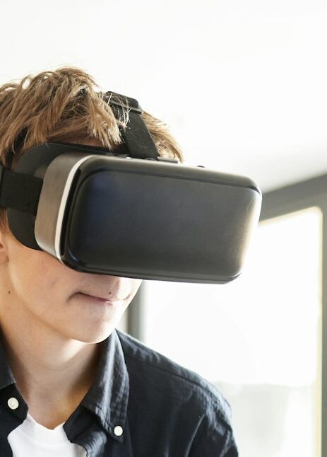 Young boy playing VR game at home